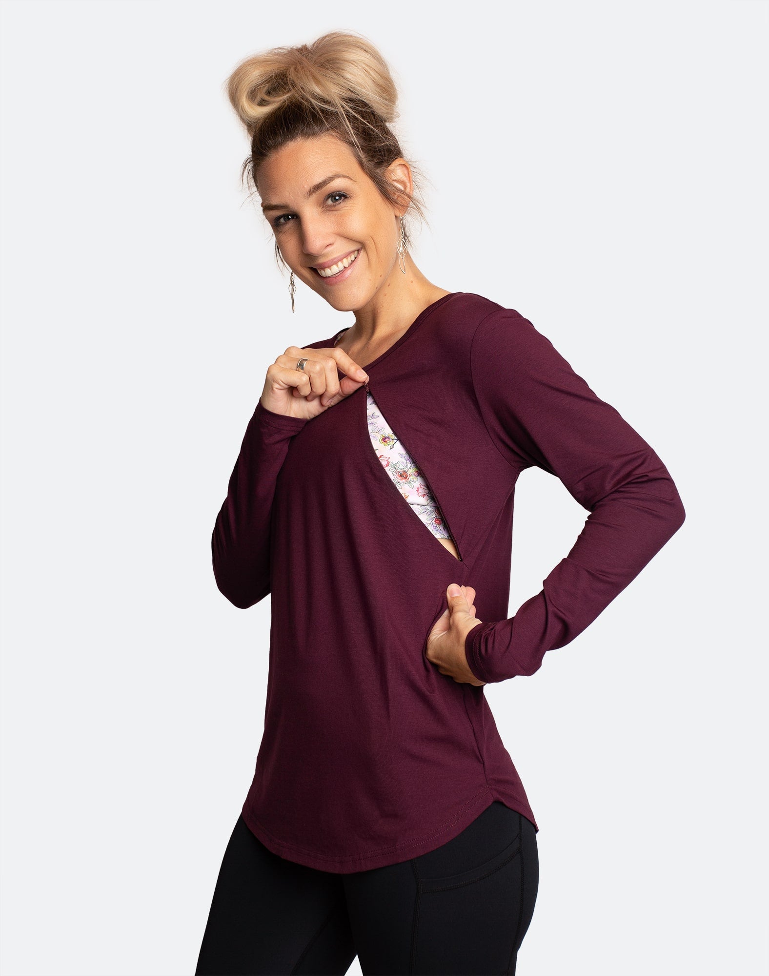 nursing mother shows zip access feeding on long sleeve maternity top