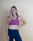 Mum wearing pink breastfeeding sports bra with dropdown cup unclipped