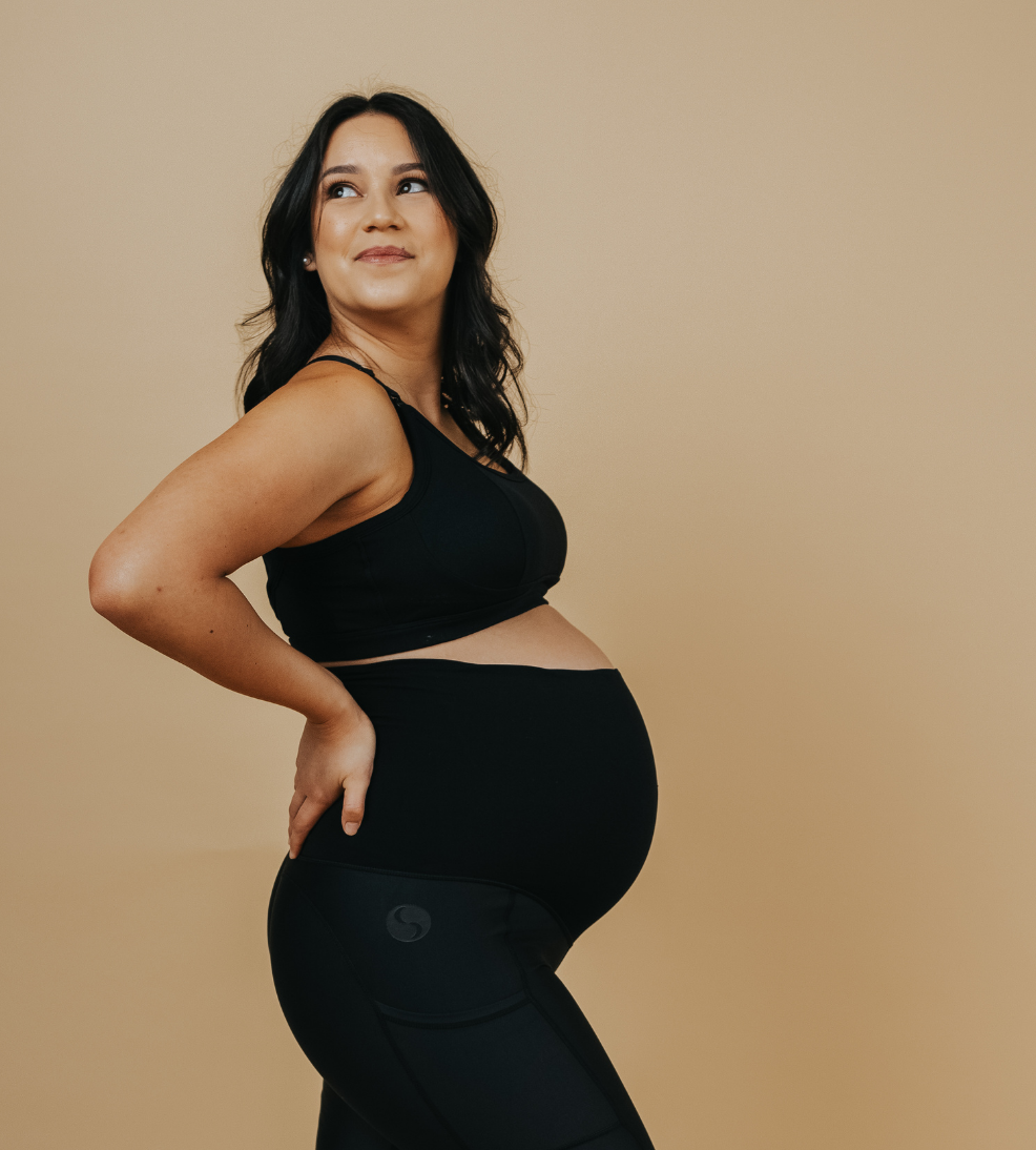 mum wearing a black racerback nursing bra side view