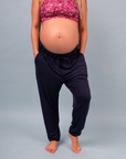 front view of a fit mother wearing navy bamboo jogger trousers