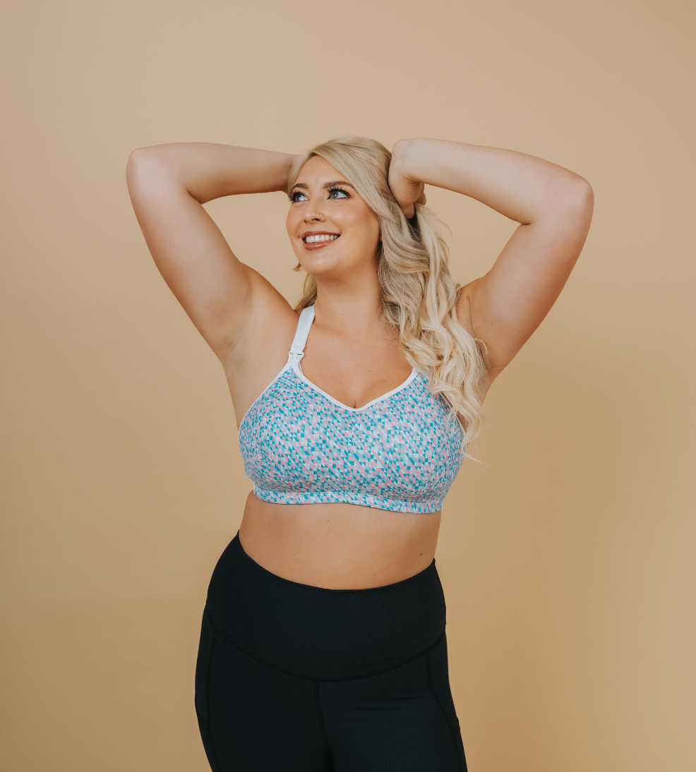 side on view of a happy mum wearing a confetti nursing sports bra