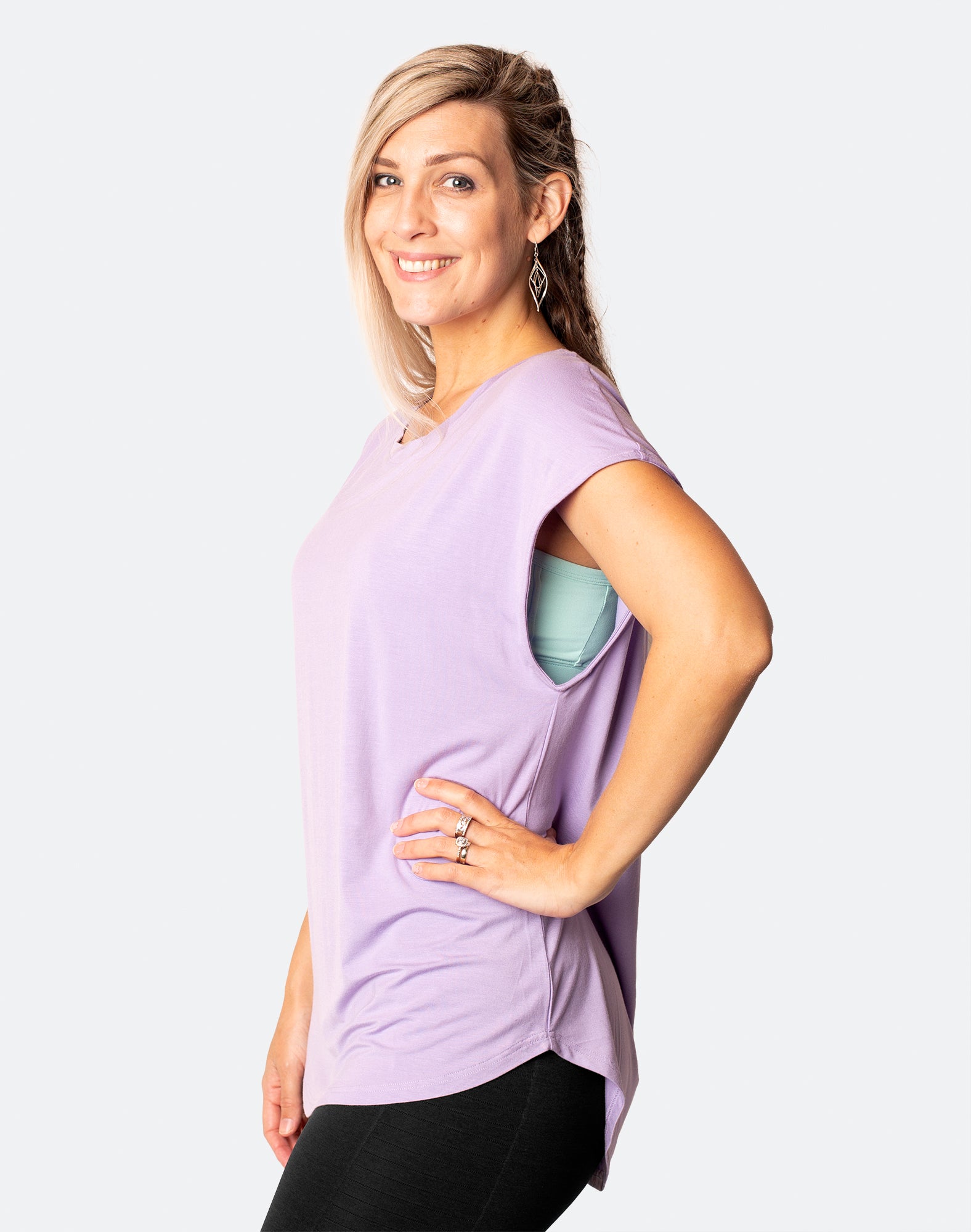 side view of active happy mum wearing a relaxed fit lavender tee with wide armholes for breastfeeding