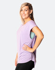 side view of active happy mum wearing a relaxed fit lavender tee with wide armholes for breastfeeding