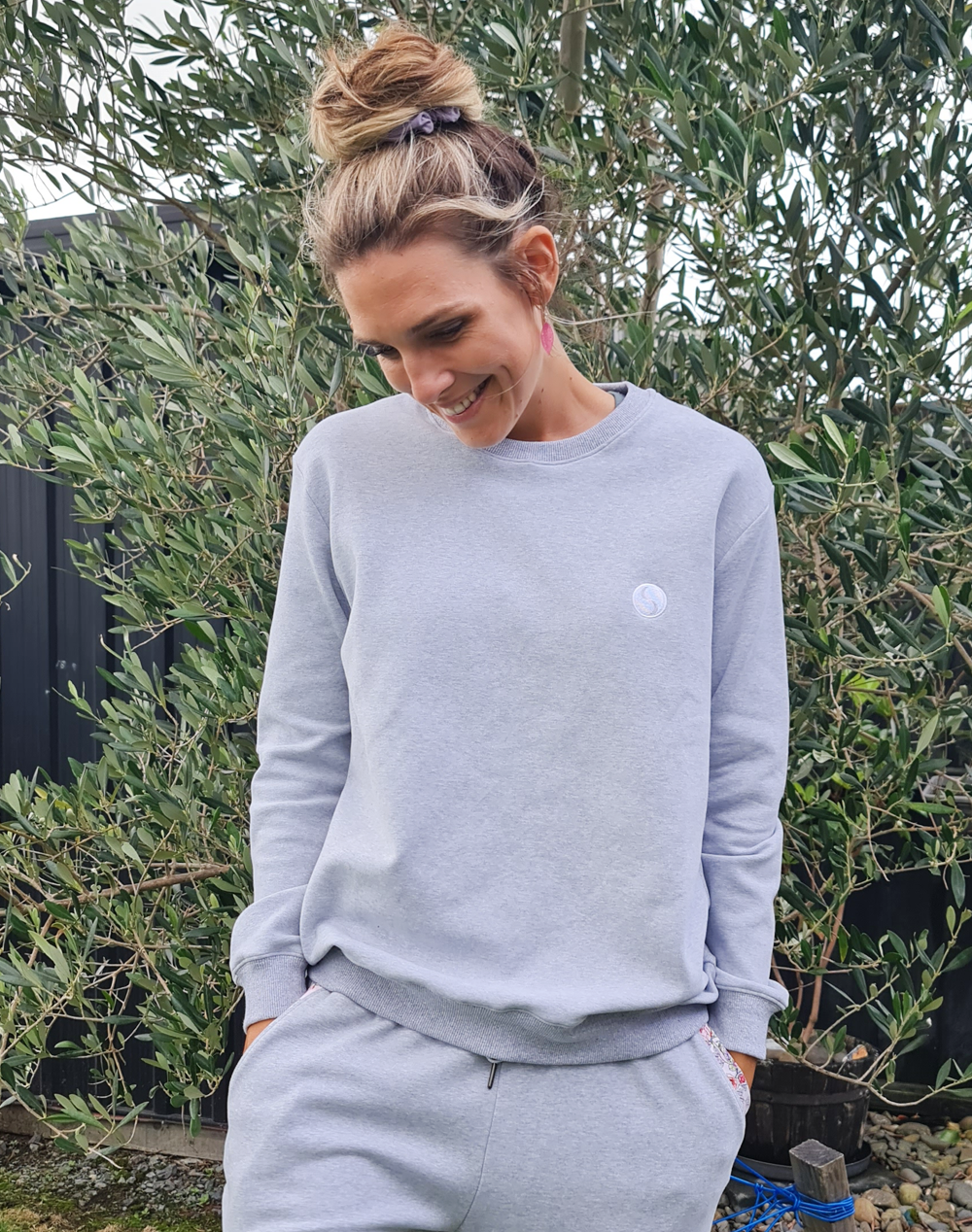 Happy mother wearing a grey women's crew neck sweatshirt