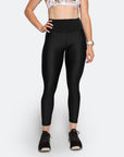 active mother wearing black postpartum compression leggings in black