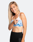 Happy mum wearing nursing running bra in blue and white print