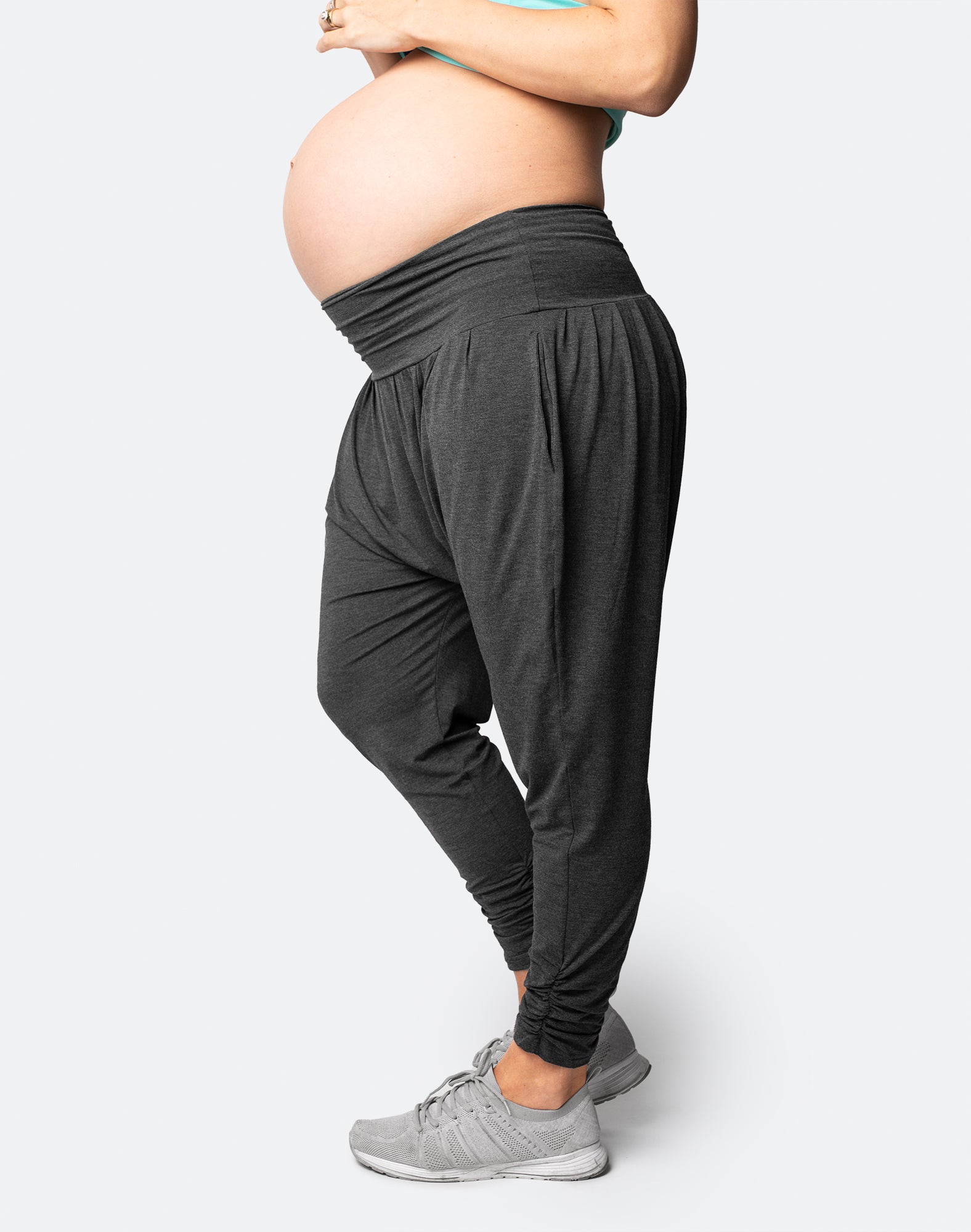 pregnant woman in grey harem maternity pants