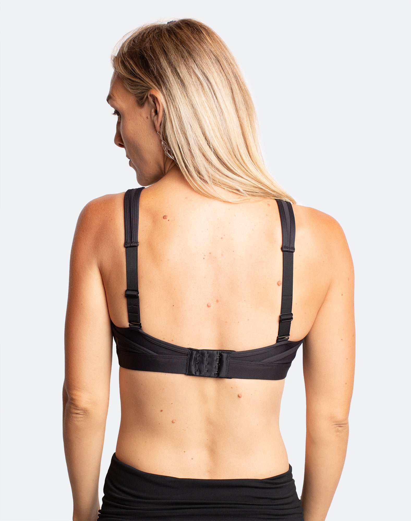 Back view of black pumping sports bra