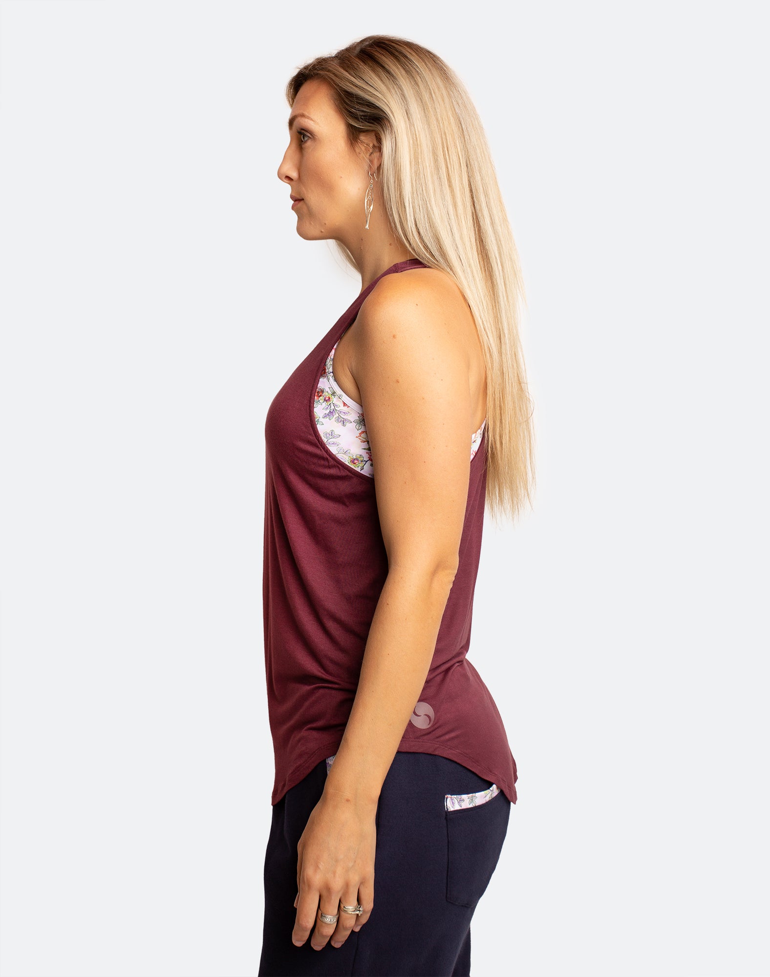 Side view of active mum wearing sangria breastfeeding tank