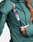 Nursing zip function on a green activewear hoodie