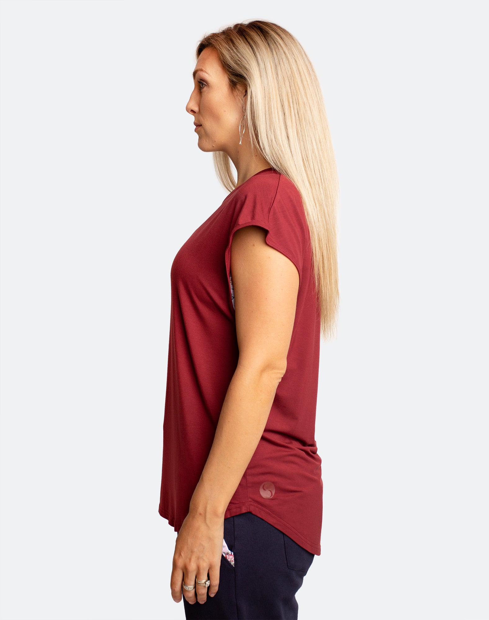 side view of active mum wearing a relaxed fit ruby tee with wide armholes for breastfeeding