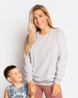 Happy mum with son wearing her maternity activewear