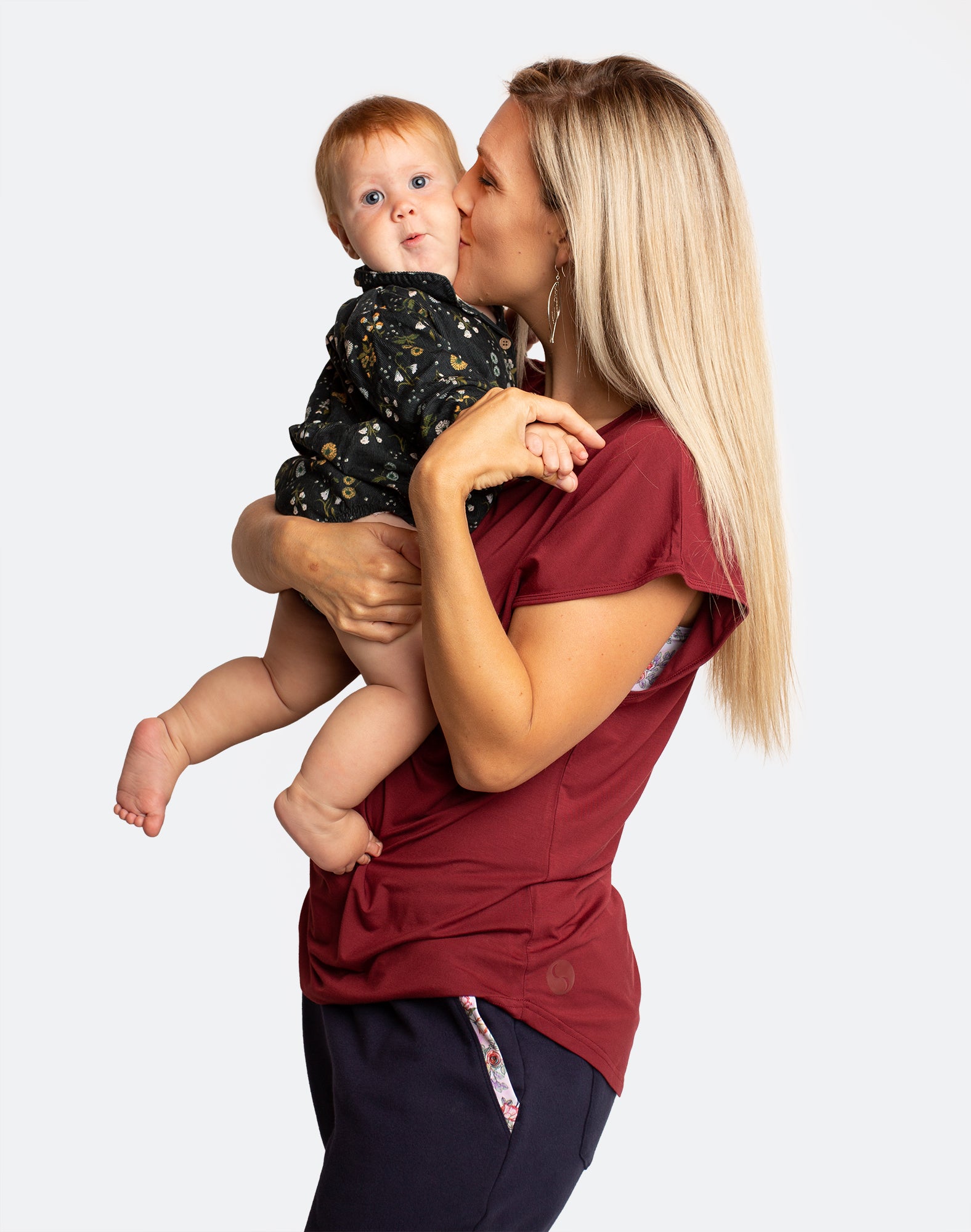 Breastfeeding mother wearing the best maternity activewear