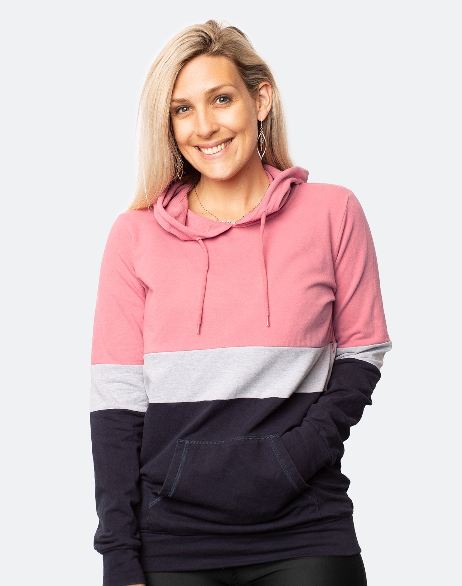 Front view of active mum wearing block coloured breastfeeding hoodie with the hood on