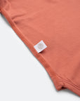 Orange baby onesie in bamboo material