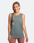 Active mother wearing a sage green summer nursing top