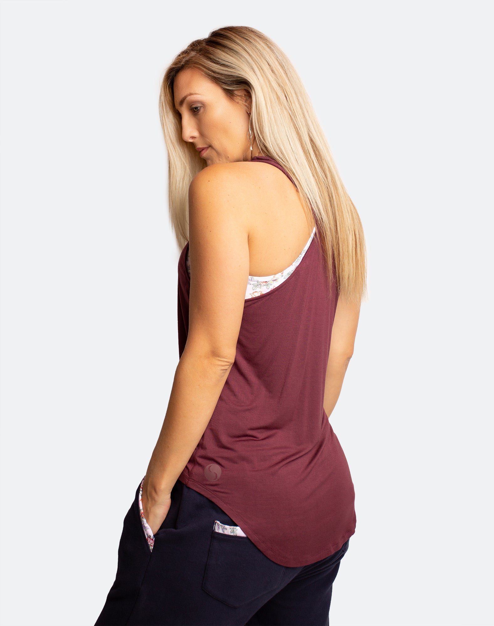 Back view of active mum wearing sangria breastfeeding tank