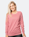 Side view of active mother wearing rose pink maternity nursing jumper