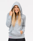 front view active mum wearing a grey casual breastfeeding hoodie with the hood up