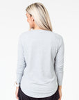 back view of a mum wearing a grey maternity top with long sleeves