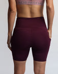 Back view of postpartum bike shorts with pockets