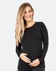 back view of a pregnant lady wearing a black maternity top with long sleeves