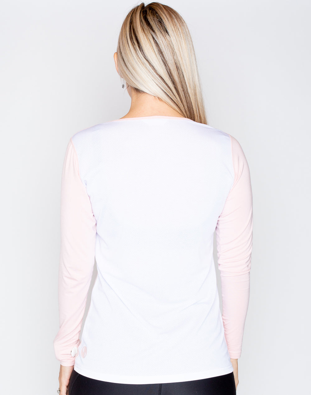 rear view of a fit mum wearing a colourful maternity top