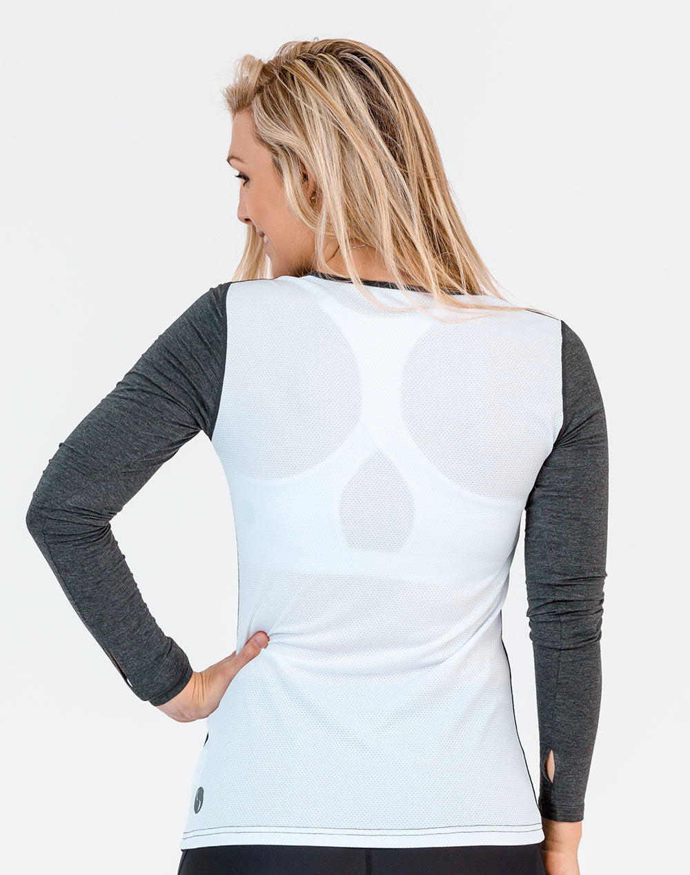 side view of a mum wearing a grey and white maternity top with long sleeves