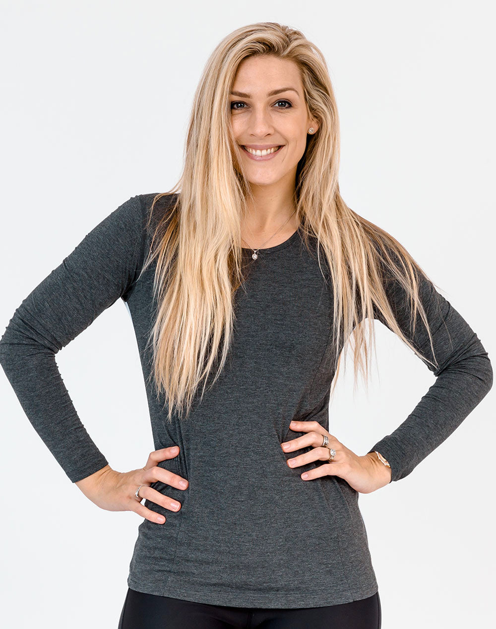 front view of an active mum wearing a grey maternity top with long sleeves