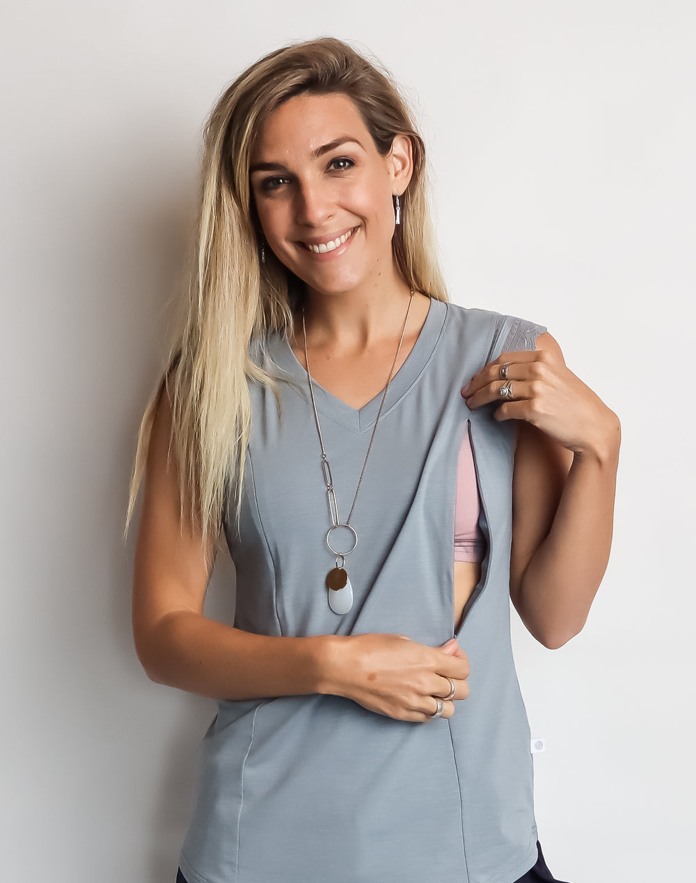 Model showing the nursing zip function on maternity top