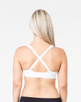 back view of a pregnant mum wearing a white playtime bra with the option to cross straps over