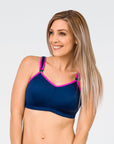 front view of a mum in a navy nursing sports bra with pink lining 