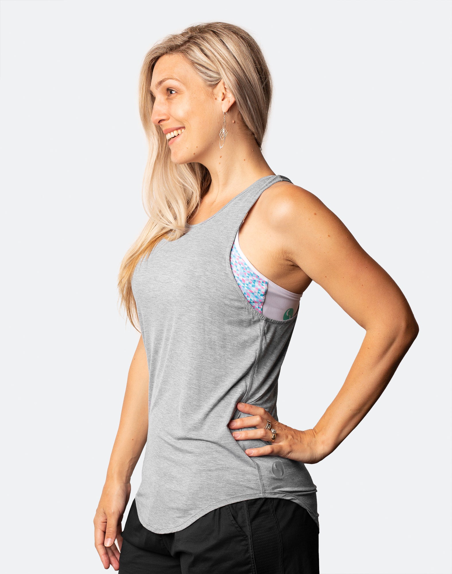 side view of active mum wearing rise up tank in grey marle