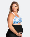 Side view of happy, pregnant mother wearing maternity activewear