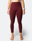 Front view of active mum wearing 7/8 high waisted leggings