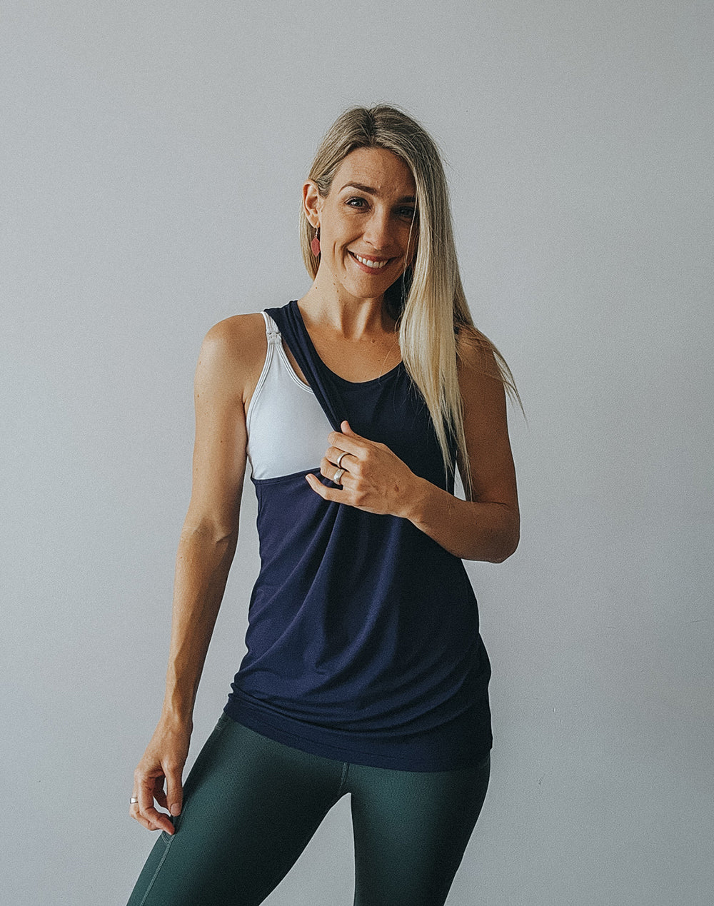 Model wearing blue maternity tank top