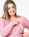 pink maternity top with long sleeves and invisible zip unzipped close up