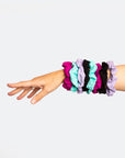 A collection of elastic hair scrunchies in various colours