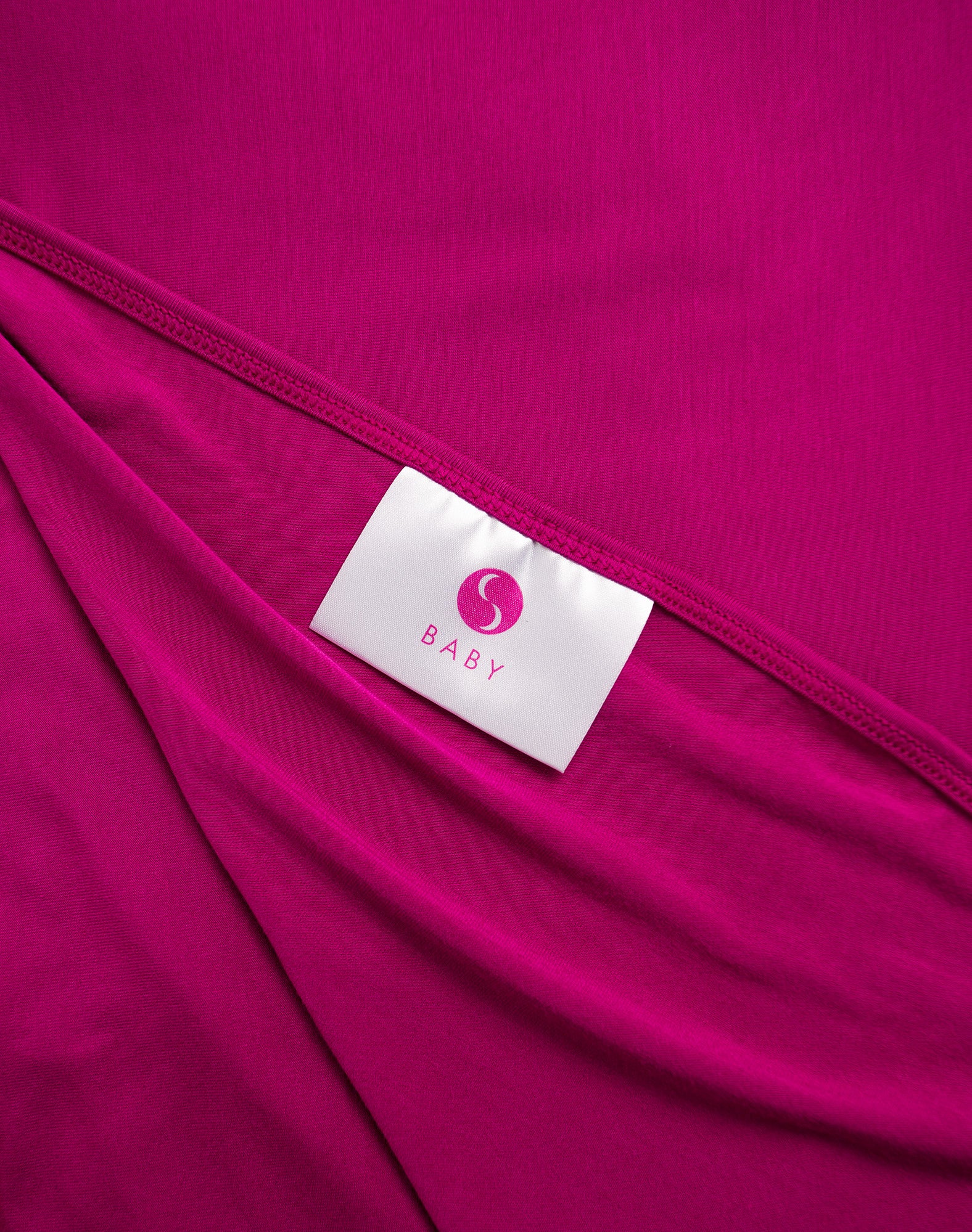 Close up view of bamboo baby swaddle with Cadenshae logo