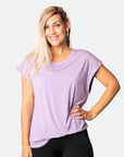 active happy mum wearing a relaxed fit lavender tee with wide armholes for breastfeeding