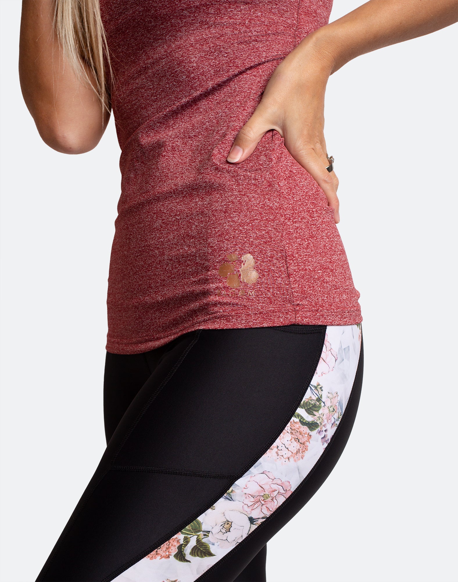 Red nursing tank and black postnatal exercise tights with floral detailing