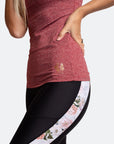 Red nursing tank and black postnatal exercise tights with floral detailing