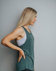 Side view of green twist back maternity tank