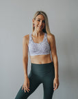 Fit mother wearing racerback breastfeeding sports bra